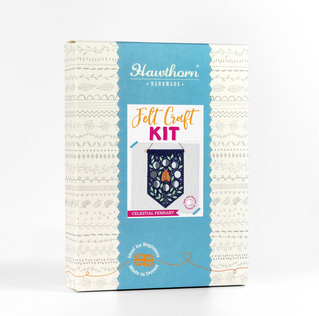 Felt craft kit packaging with blue and white design on a white background