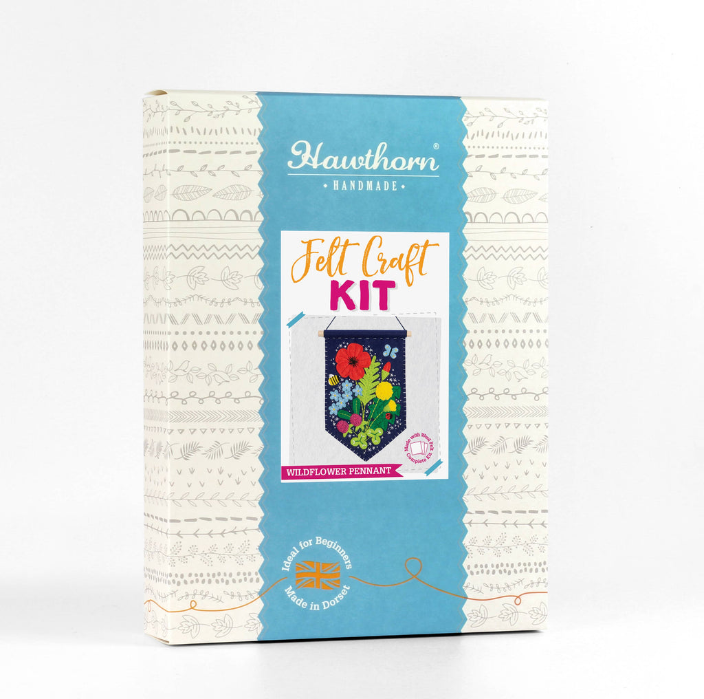 Felt craft kit packaging with floral design on a white background